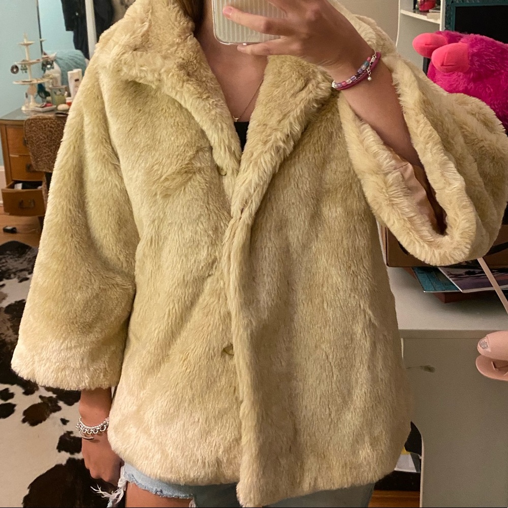 A beige Trade mark fur coat with a classy fit.